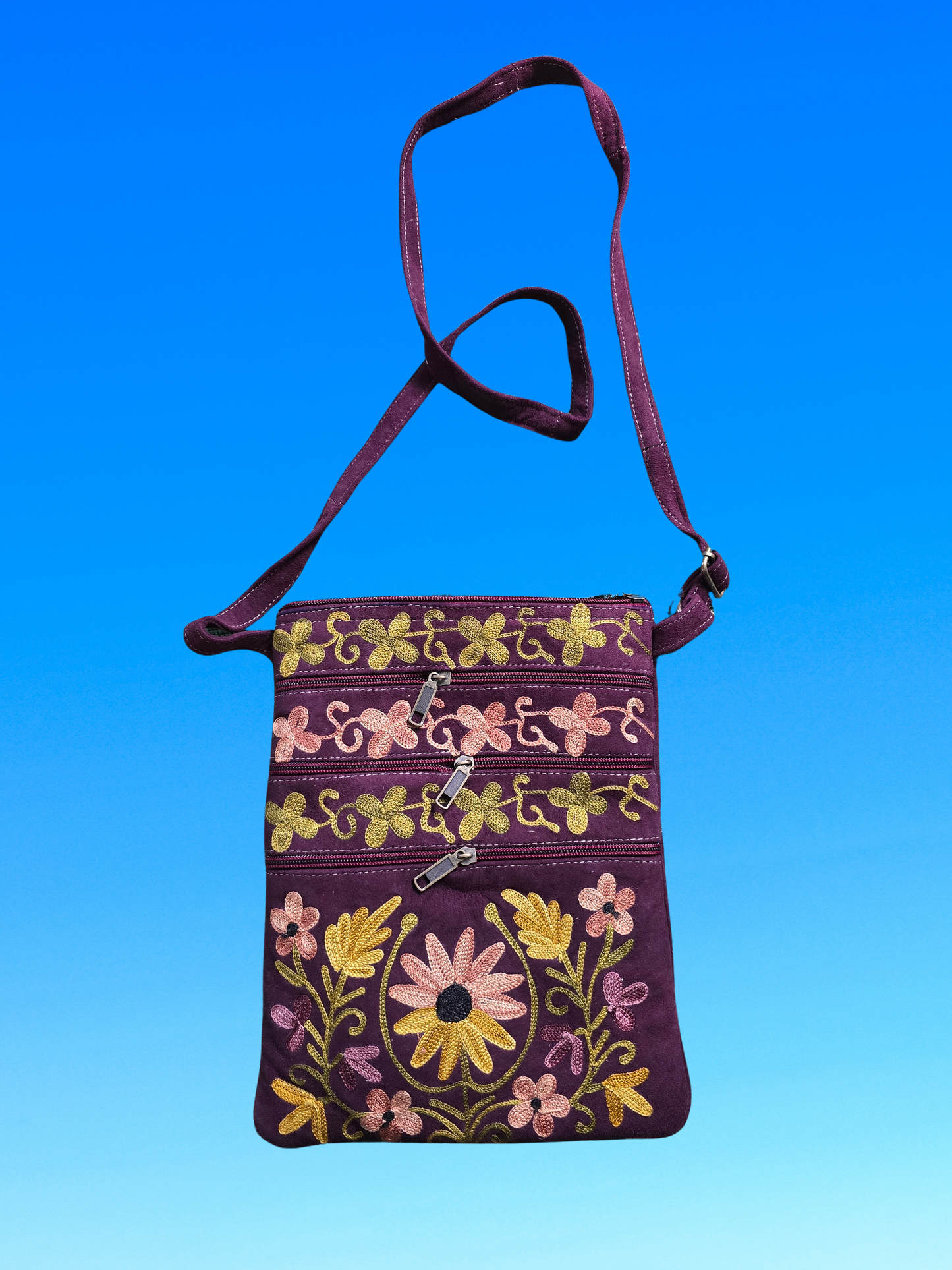 Sac à bandoulière en toile brodée de motifs floraux